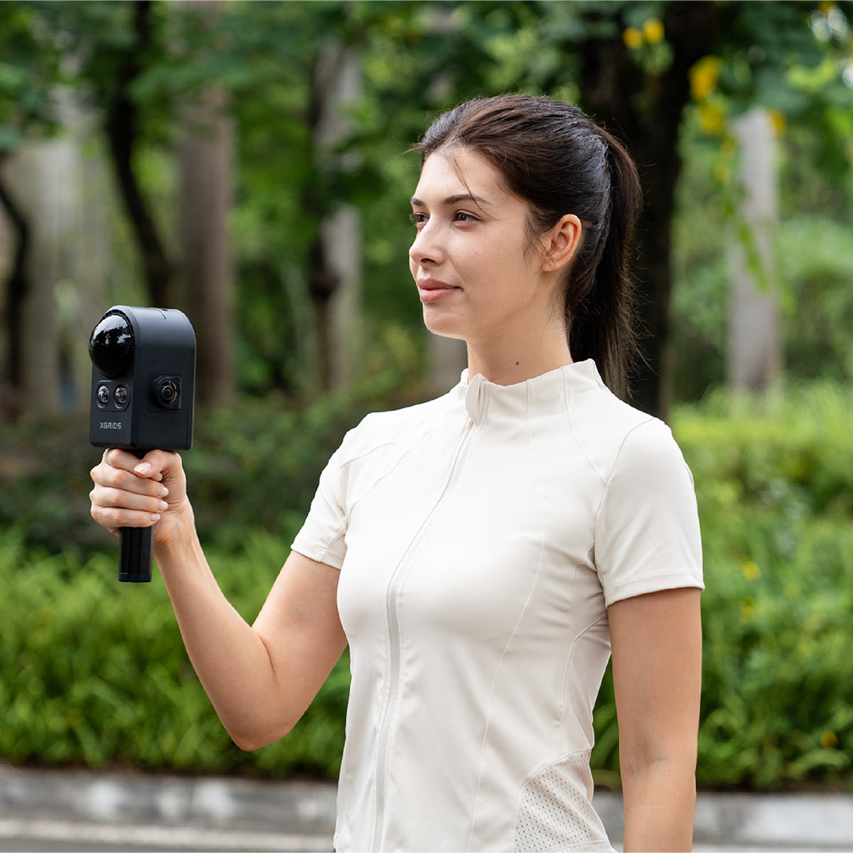 XGRIDS PortalCam being used handheld outdoors